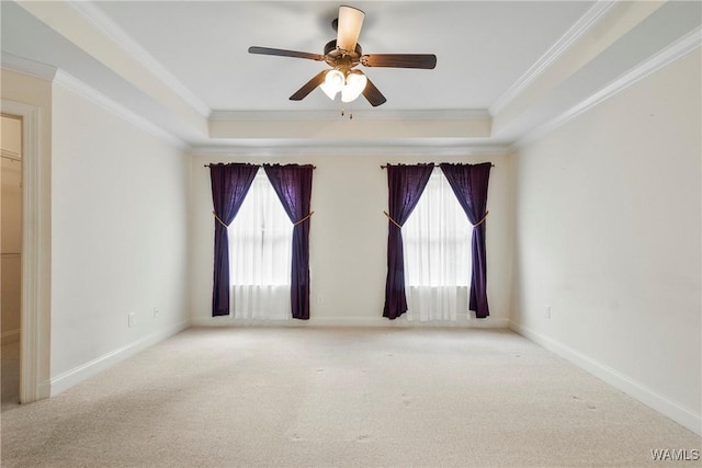 9437 Crete Cir, Tuscaloosa, AL 35406 - unfurnished room featuring a tray ceiling, carpet floors, crown molding, and a ceiling fan