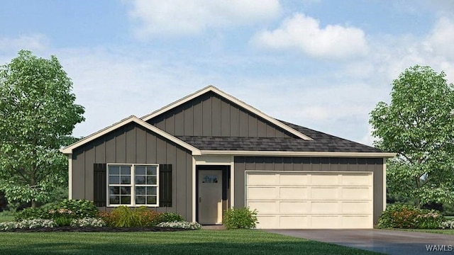 view of front of home featuring a front lawn and a garage