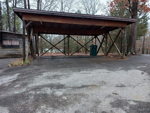 view of parking / parking lot with a carport