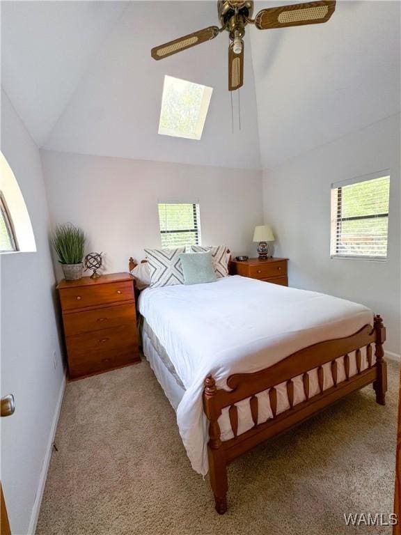 carpeted bedroom featuring lofted ceiling and ceiling fan