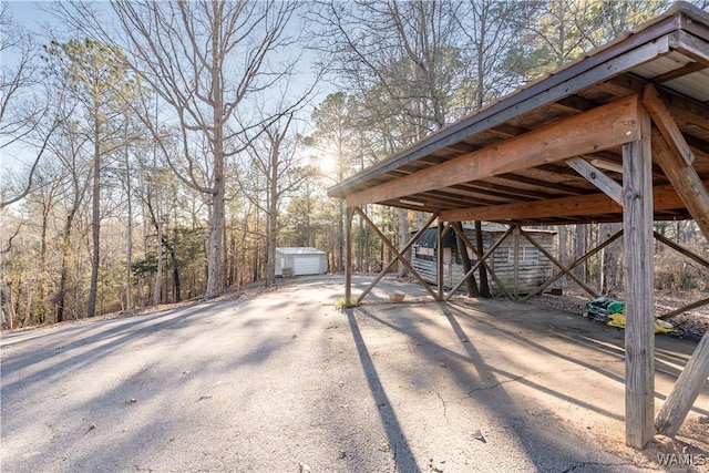 view of patio featuring an outbuilding