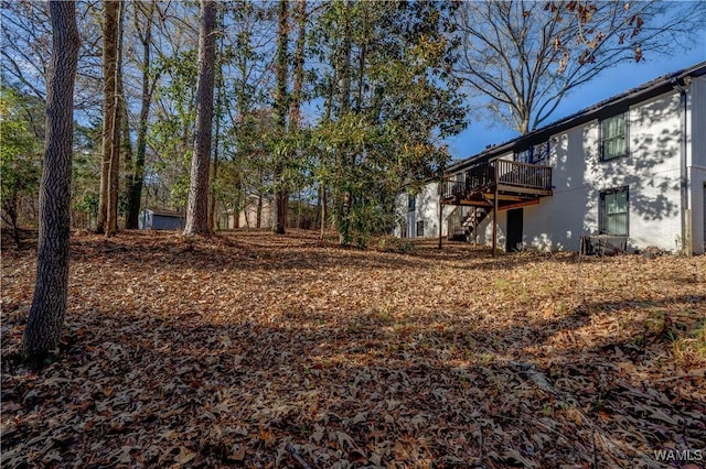 view of yard featuring a wooden deck