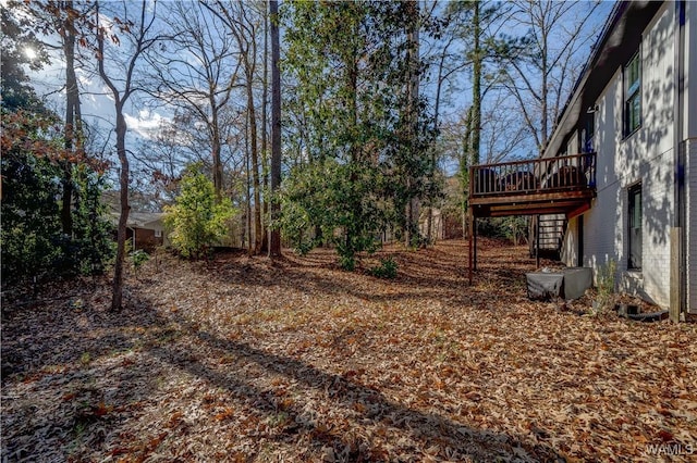 view of yard with a wooden deck