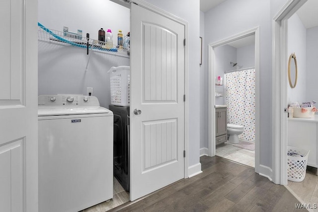 19026 Eastern Valley Rd, West Blocton, AL 35184 - clothes washing area with wood finished floors and baseboards