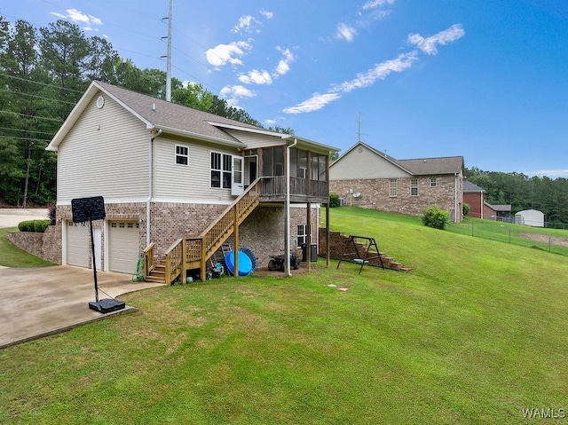 19026 Eastern Valley Rd, West Blocton, AL 35184 - rear view of house featuring a sunroom, brick siding, driveway, an attached garage, and stairway
