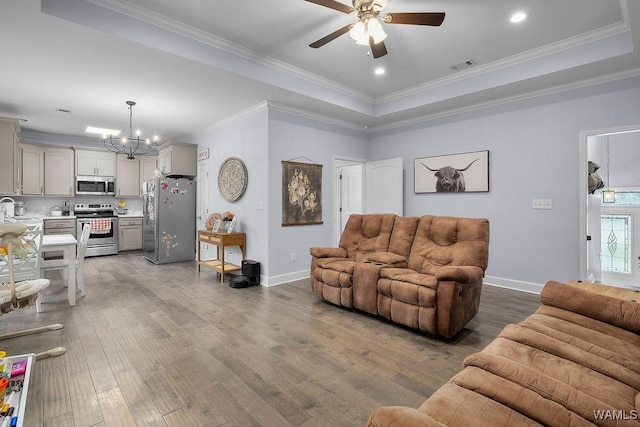 19026 Eastern Valley Rd, West Blocton, AL 35184 - living area with ceiling fan, a raised ceiling, a chandelier, wood finished floors, and crown molding