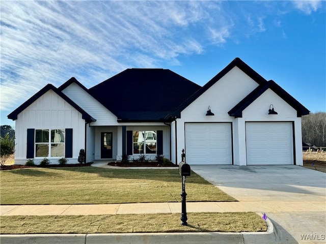 view of front facade with a garage and a front lawn