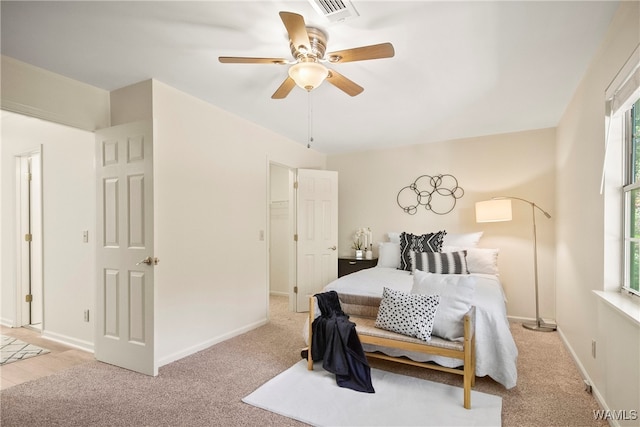 bedroom featuring ceiling fan and light colored carpet