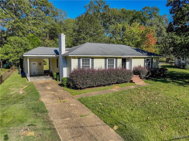 ranch-style house featuring a carport and a front lawn