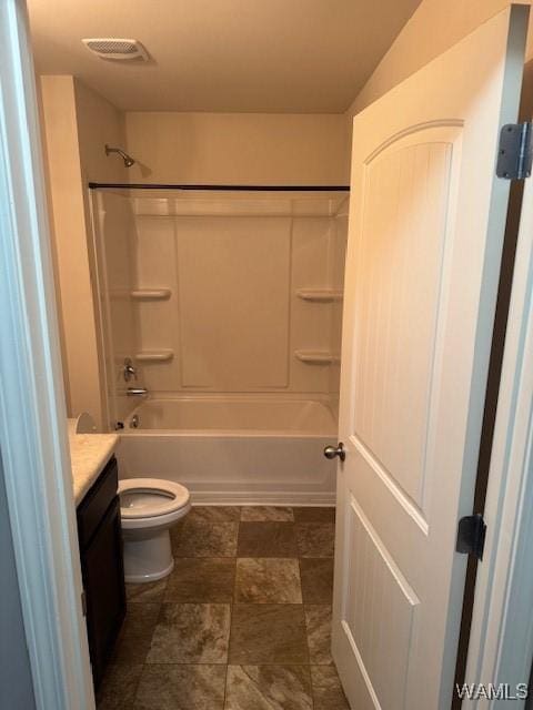 full bathroom featuring visible vents, toilet, bathtub / shower combination, and vanity