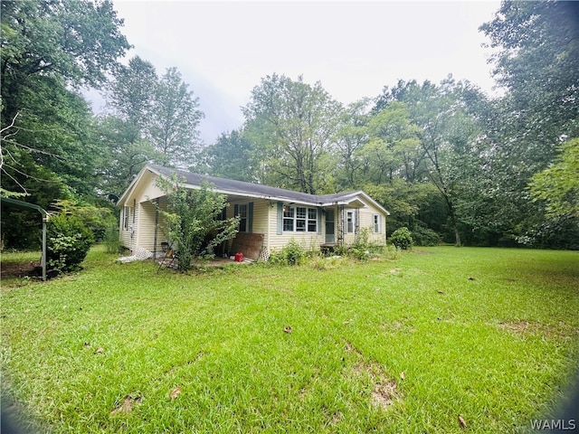 view of front of house with a front lawn