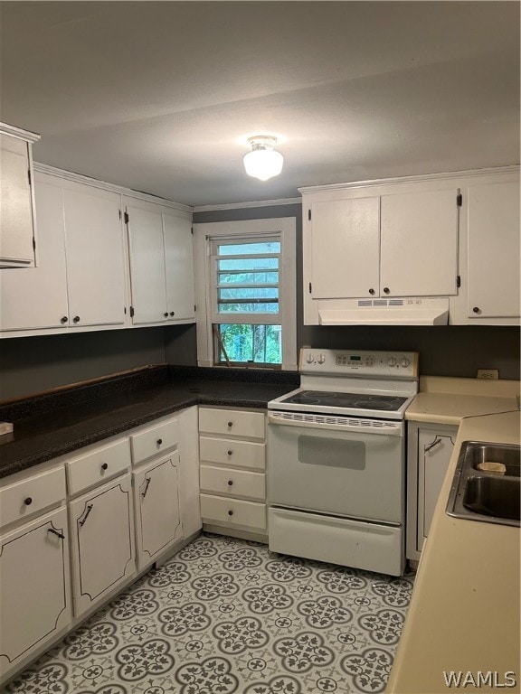 kitchen featuring white cabinets, white electric range, and sink