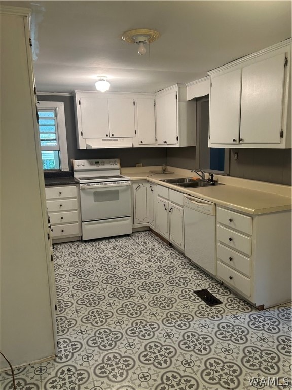 kitchen with white cabinets, white appliances, and sink