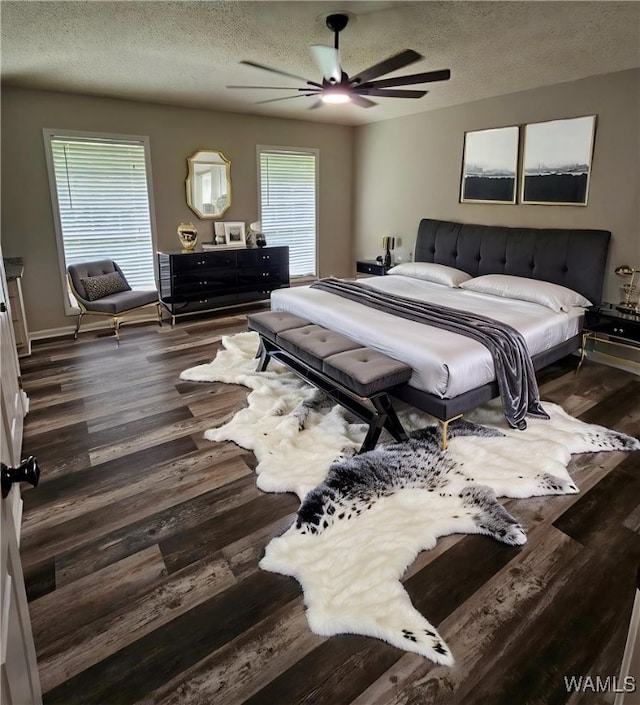 14541 Keenes Mill Rd, Coaling, AL 35453 - bedroom featuring a textured ceiling, wood finished floors, and a ceiling fan