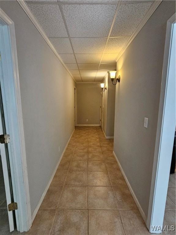14541 Keenes Mill Rd, Coaling, AL 35453 - hallway featuring tile patterned floors, crown molding, a paneled ceiling, and baseboards