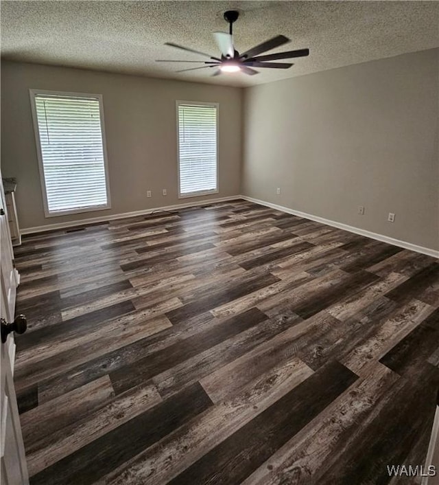 14541 Keenes Mill Rd, Coaling, AL 35453 - empty room featuring ceiling fan, a textured ceiling, dark wood-style floors, and baseboards