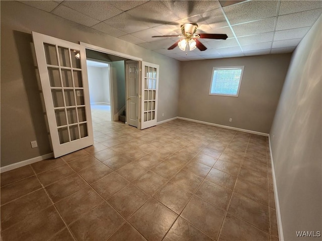 14541 Keenes Mill Rd, Coaling, AL 35453 - tiled spare room featuring a paneled ceiling, ceiling fan, and baseboards