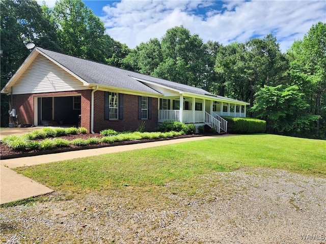 14541 Keenes Mill Rd, Coaling, AL 35453 - ranch-style house featuring a porch, brick siding, a front yard, driveway, and a garage