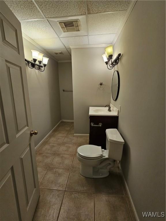14541 Keenes Mill Rd, Coaling, AL 35453 - half bath with toilet, vanity, tile patterned floors, baseboards, and ornamental molding