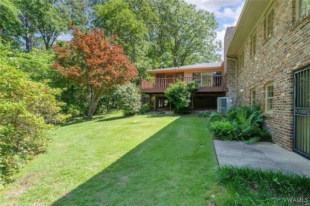 5204 Dove Creek Ave, Northport, AL 35473 - view of green lawn featuring cooling unit and a deck
