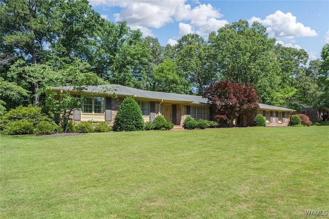 5204 Dove Creek Ave, Northport, AL 35473 - ranch-style home featuring a front yard and brick siding