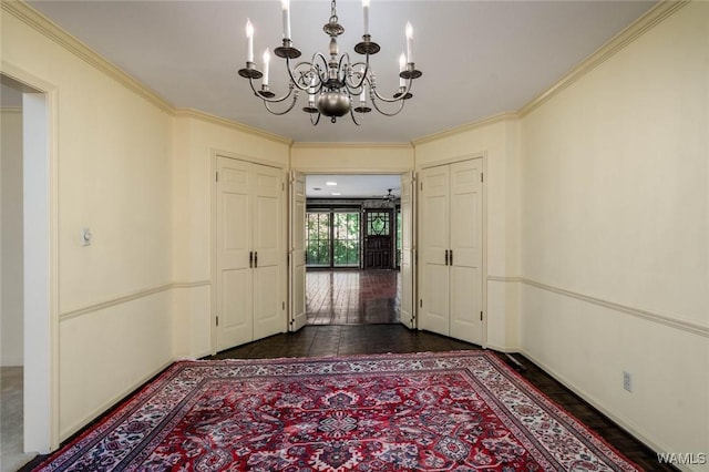 5204 Dove Creek Ave, Northport, AL 35473 - foyer entrance featuring a chandelier, crown molding, and baseboards