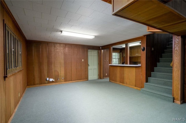 5204 Dove Creek Ave, Northport, AL 35473 - finished below grade area featuring stairs, wood walls, baseboards, and carpet
