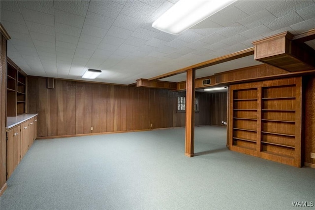 5204 Dove Creek Ave, Northport, AL 35473 - finished basement featuring wooden walls, light colored carpet, and built in shelves