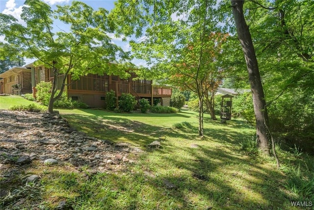 5204 Dove Creek Ave, Northport, AL 35473 - view of green lawn with a wooden deck