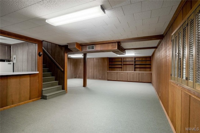 5204 Dove Creek Ave, Northport, AL 35473 - basement featuring wood walls, stairs, carpet floors, and baseboards