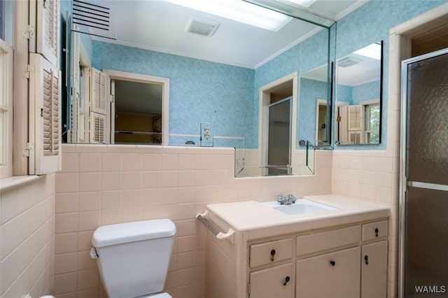 5204 Dove Creek Ave, Northport, AL 35473 - bathroom featuring ornamental molding, toilet, a stall shower, vanity, and wallpapered walls