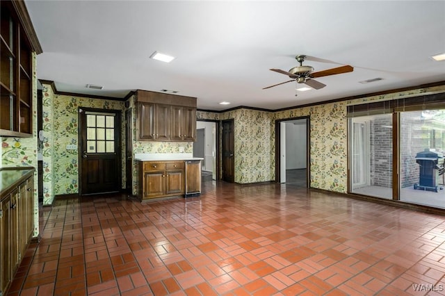 5204 Dove Creek Ave, Northport, AL 35473 - kitchen featuring wallpapered walls, brick patterned floors, light countertops, a ceiling fan, and ornamental molding