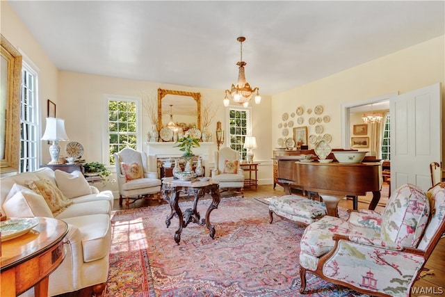 living room featuring a notable chandelier and light hardwood / wood-style flooring