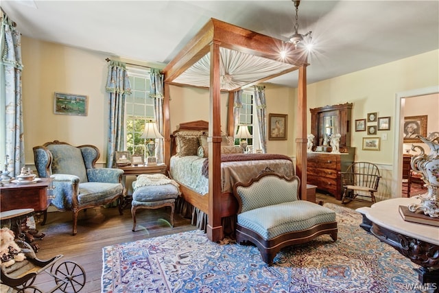 bedroom with hardwood / wood-style flooring