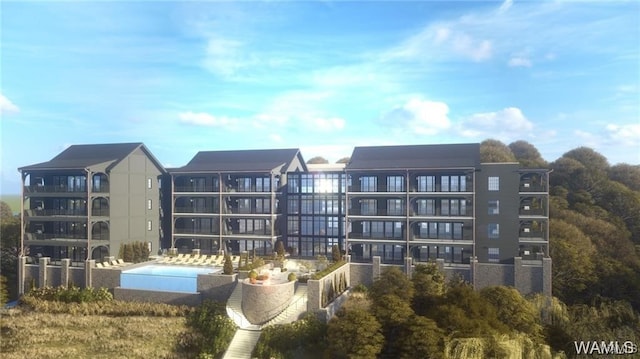 view of property with a community pool