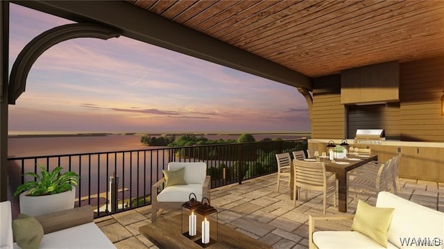 balcony at dusk with area for grilling, outdoor dining area, and a water view