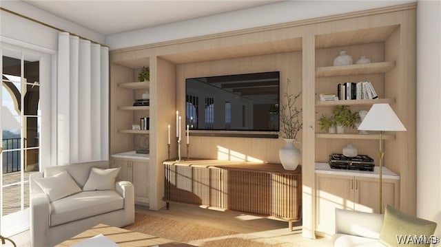 living area featuring light wood-style flooring and built in shelves