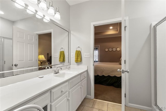 bathroom featuring tile patterned floors, vanity, and walk in shower