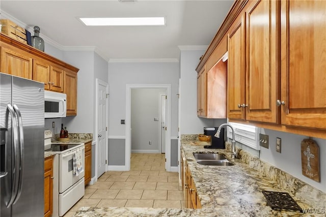 kitchen with sink, white appliances, light tile patterned flooring, light stone countertops, and ornamental molding