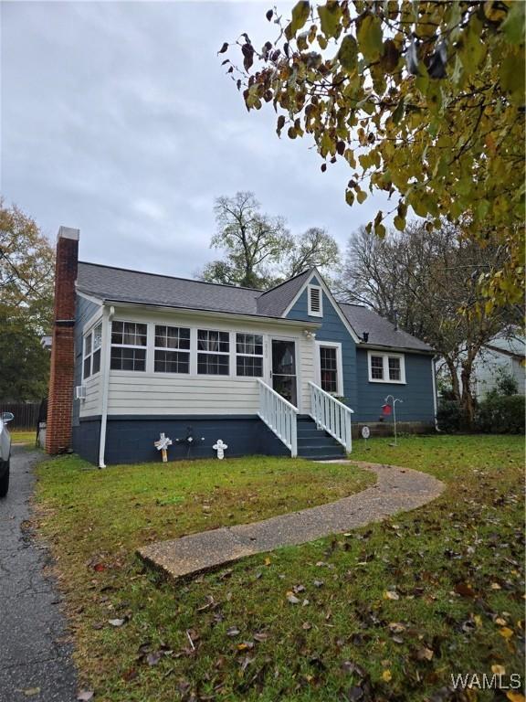 view of front of home with a front yard