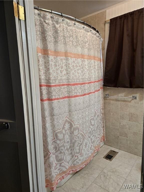 bathroom with tile patterned flooring