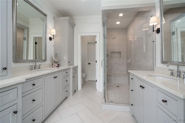 1901 Point Clear Rd, Tuscaloosa, AL 35406 - bathroom with crown molding, a sink, and a shower stall