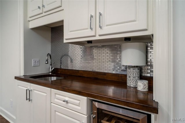 1901 Point Clear Rd, Tuscaloosa, AL 35406 - bar with wine cooler, backsplash, and a sink