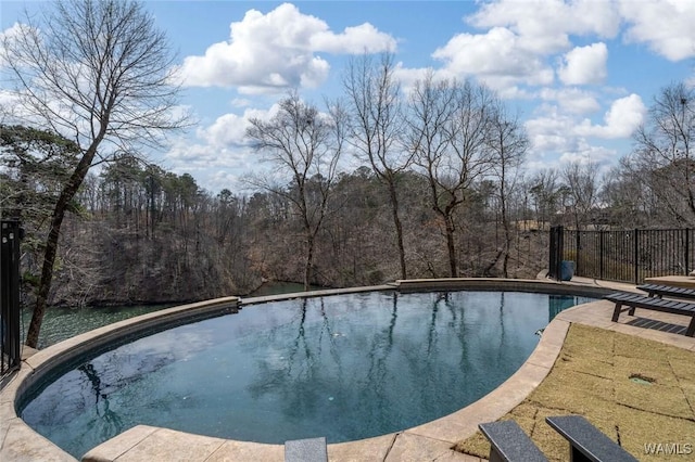 1901 Point Clear Rd, Tuscaloosa, AL 35406 - pool with a wooded view, a patio, and fence