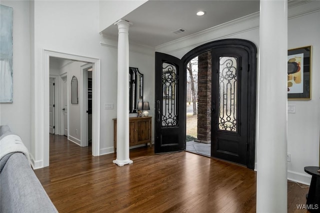1901 Point Clear Rd, Tuscaloosa, AL 35406 - foyer entrance featuring arched walkways, wood finished floors, visible vents, ornamental molding, and ornate columns