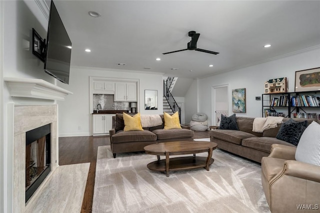 1901 Point Clear Rd, Tuscaloosa, AL 35406 - living area with recessed lighting, wood finished floors, a high end fireplace, stairs, and ornamental molding