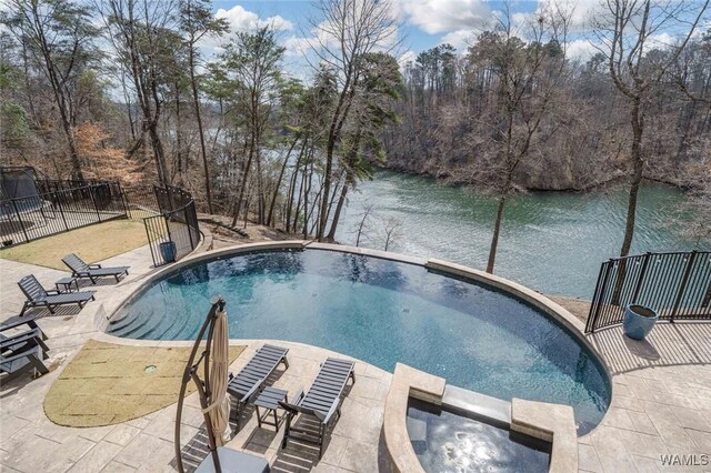 1901 Point Clear Rd, Tuscaloosa, AL 35406 - view of pool with a patio, a water view, fence, and a pool with connected hot tub