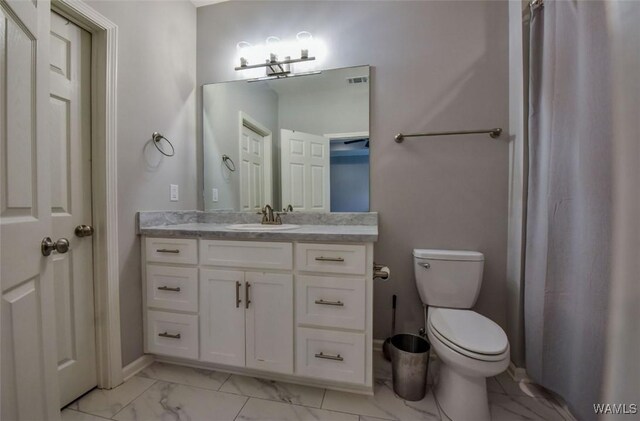 17818 Alecia Dr, Vance, AL 35490 - bathroom with marble finish floors, toilet, vanity, and baseboards