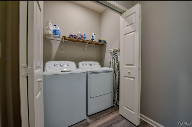 17818 Alecia Dr, Vance, AL 35490 - laundry area featuring wood finished floors and independent washer and dryer