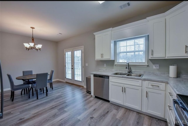 17818 Alecia Dr, Vance, AL 35490 - kitchen featuring stainless steel appliances, a sink, light wood-style flooring, and a chandelier